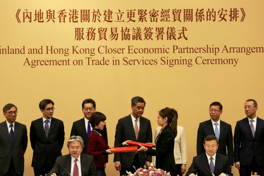 Chief Executive Leung Chun-ying (standing in centre) at the agreement signing ceremony today. Photo: Nora Tam