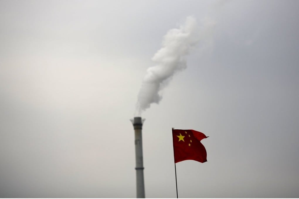China's national flag is seen in front of a chimney of a cogeneration plant in Beijing, China. Photo: Reuters
