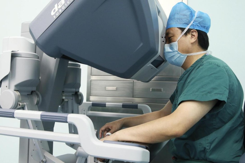 A doctor operates on a patient with a surgical robot in Hefei, Anhui. When it comes to advancing scientific knowledge, our differences should be set aside in the understanding that research is for the common good of humanity. Photo: Reuters