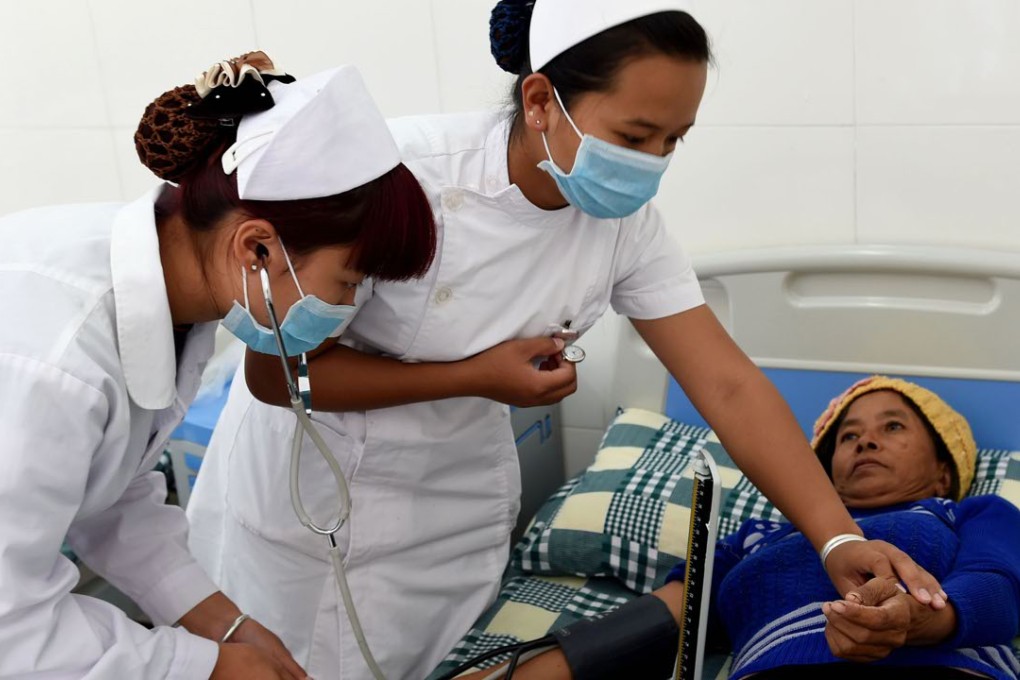 Medial workers attend to a woman at a health center in China as the country braces for a large increase in its elderly population. Photo: Xinhua