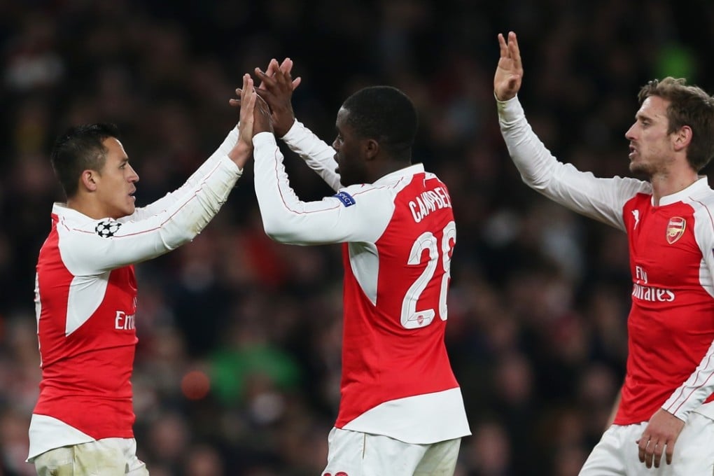 Alexis Sanchez celebrates with team mates after scoring the third goal for Arsenal against Dinamo Zagreb as they returned to winning ways. Photo: Reuters