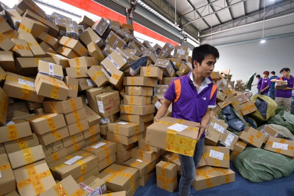 Workers sort out packages at a sorting center in Guangzhou, capital of Guangdong province, for Singles Day. Photo: Xinhua