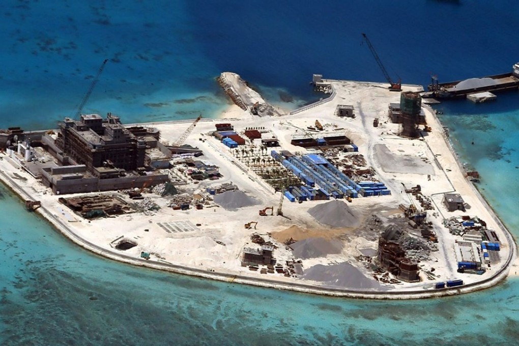 Construction work is shown at Mabini (Johnson) Reef in the disputed Spratley Islands in the South China Sea in this February 2015 file photo. China is engaged in a series of territorial disputes with its neighbours in these waters, and is now turning to the ocean to help meet its energy needs. Photo: EPA