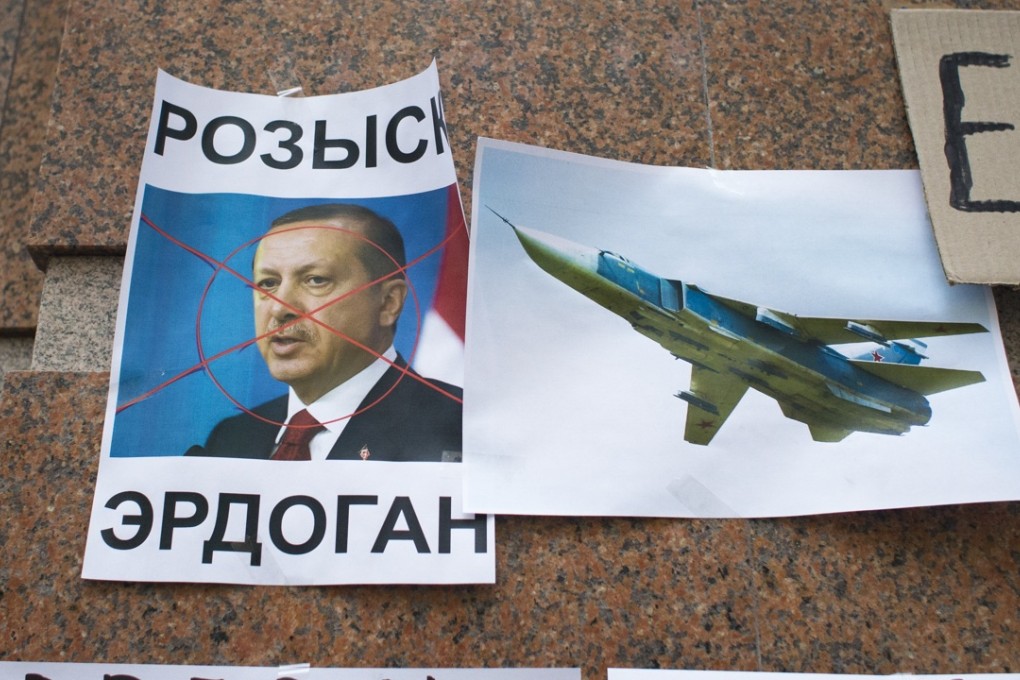 Posters showing a portrait of Turkish President Recep Tayyip Erdogan and reading "Wanted" "Erdogan, Turkey," are left after a protest at the Turkish Embassy in Moscow. Photo: AP