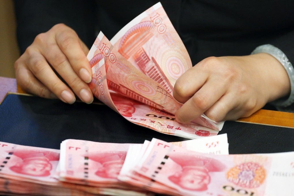 Picture shows the new 100RMB notes being tallied at a bank in Hong Kong. Photo: Felix Wong