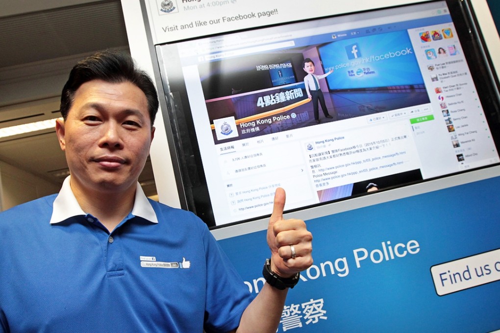 Steve Hui, with his cartoon figure during the police force’s launch of its Facebook page, in Wan Chai. Photo: Bruce Yan