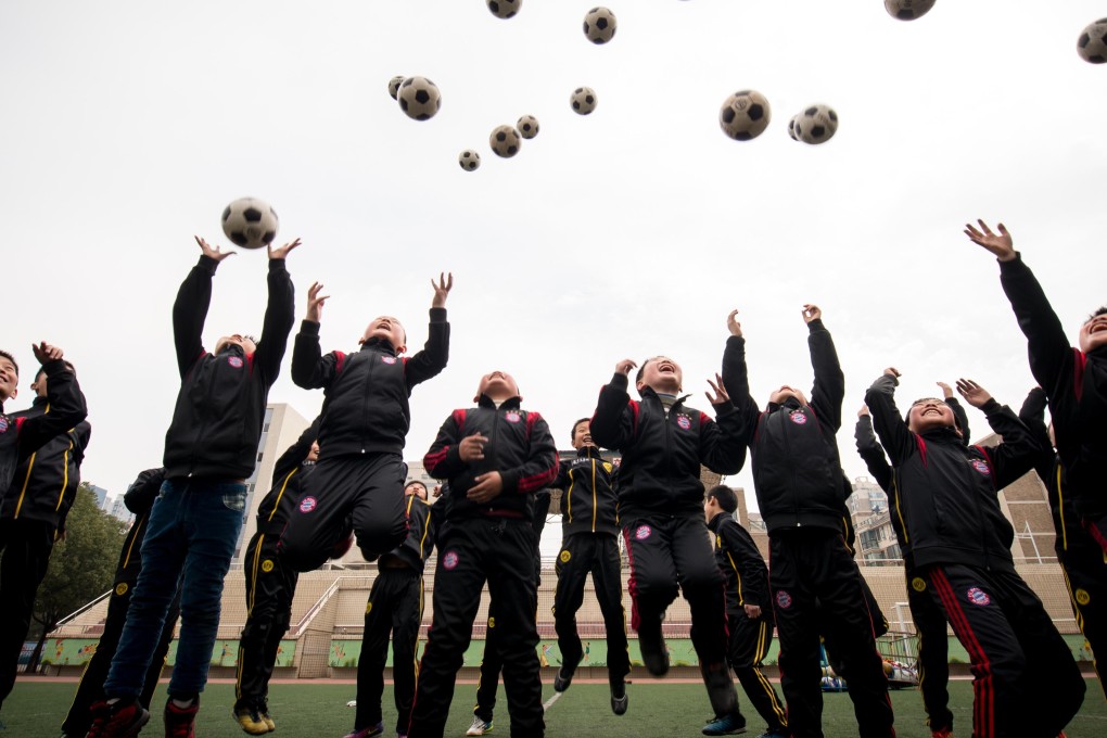 Plans to revamp soccer in China may see Shanghai employing English Premier League coaches at elite training camps for the promising youngsters, and soccer leagues featuring 280 teams from schools, colleges and universities. Photo: Xinhua