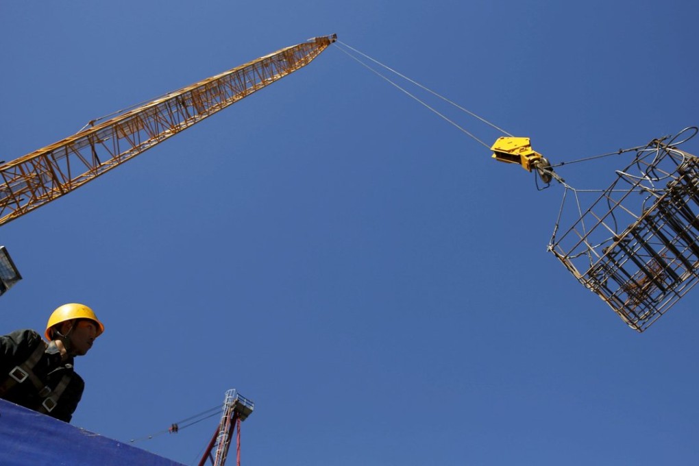 A labourer works on a construction site in Beijing. Many argue circumstances are far from ideal for China to consider lifting all capital controls. Photo: Reuters