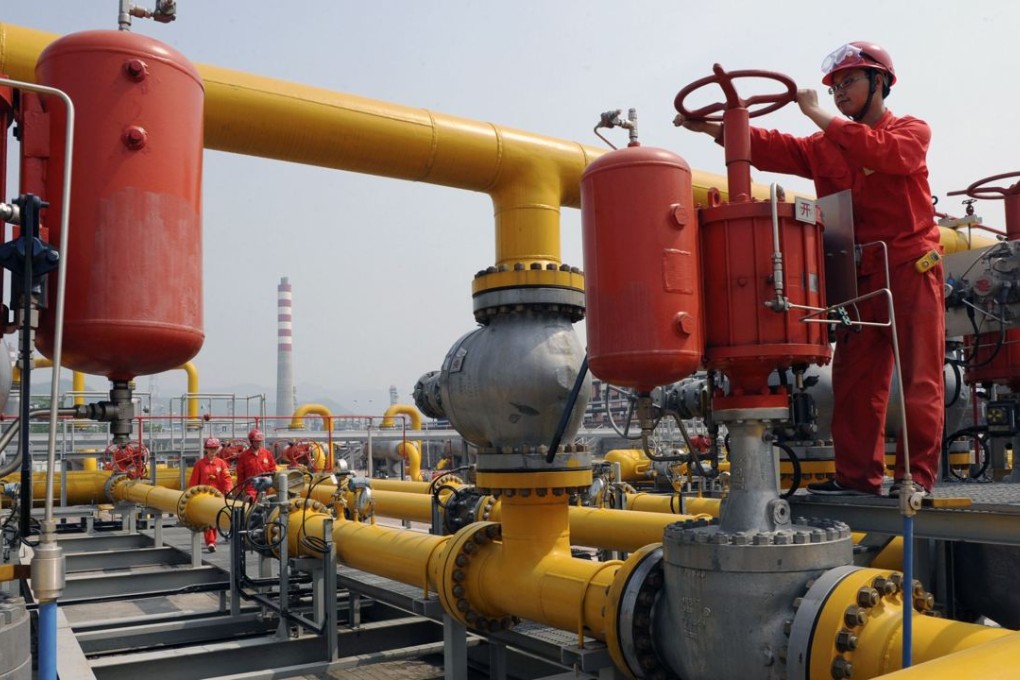 An employee checks Sinopec natural gas transmission facilities in Xuanhan county, Sichuan. Photo: Reuters