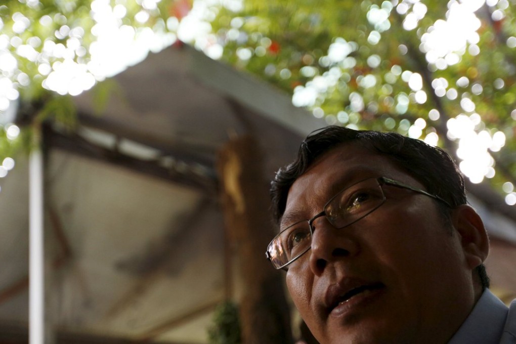 Soy Sopheap speaks at a coffee shop in Phnom Penh. The TV news anchor is trying to end the feud between Prime Minister Hun Sen and exiled opposition leader Sam Rainsy. Photo: Reuters