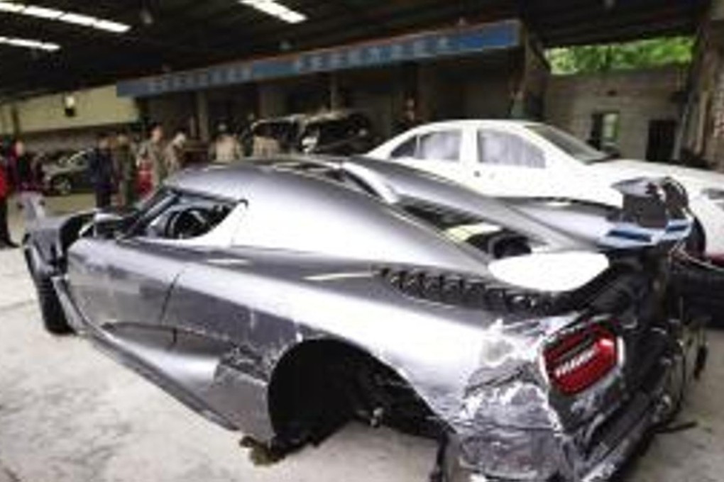 The damaged car after the crash in Chongqing. Photo: 163.com