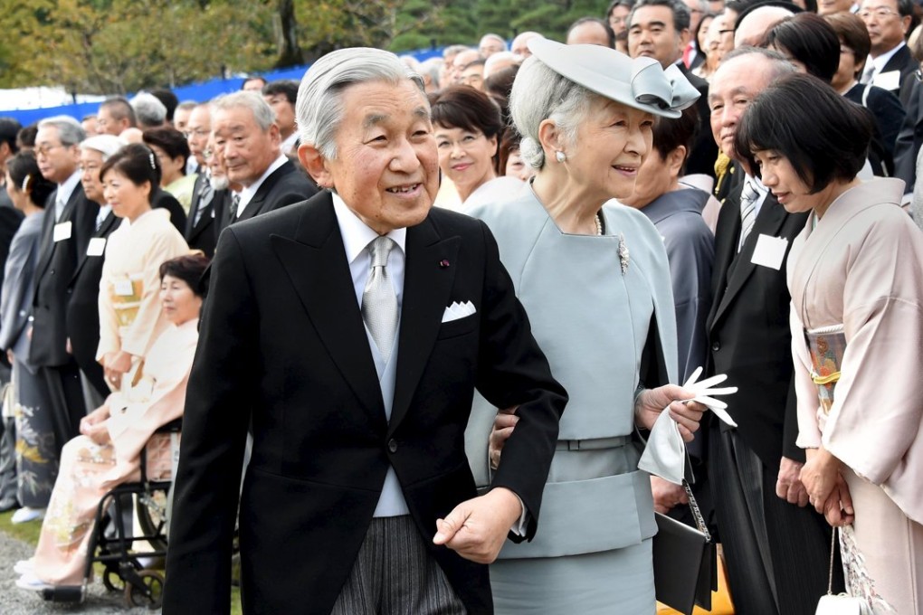 Japan's Emperor Akihito and Empress Michiko greet guests at the annual autumn garden party at the Akasaka Palace imperial garden in Tokyo on November 12. Both are aged 81 and have reduced their official duties in recent years. Photo: Reuters