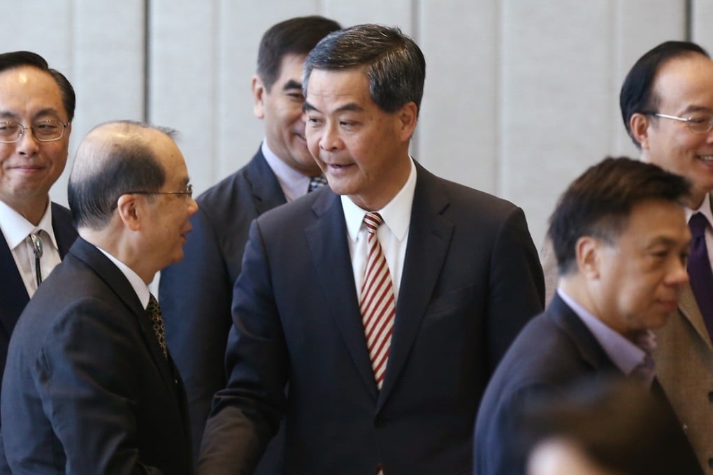 Chief Executive Leung Chun-ying (centre) with officials and lawmakers in Admiralty. Photo: Sam Tsang