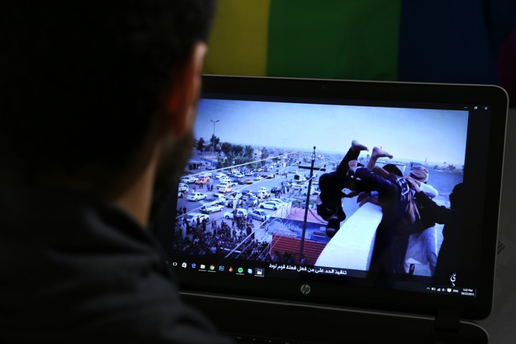 Daniel Halaby, a gay Syrian living in southern Turkey, shows a photo on his laptop of Islamic State militants throwing a man off a roof for allegedly violating the extremists’ ban on homosexuality. Photo: Associated Press