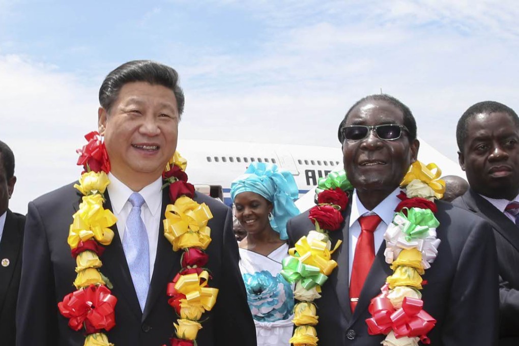 President Xi Jinping is welcomed by Zimbabwean President Robert Mugabe in Harare, Zimbabwe, on Tuesday. Photo: Xinhua