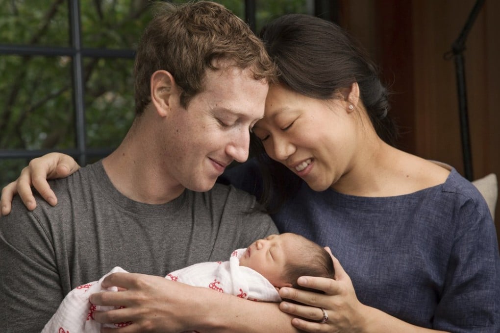 In this undated photo, Maxima Chan Zuckerberg is held by her parents, Mark Zuckerberg and Priscilla Chan Zuckerberg. Photo: AP