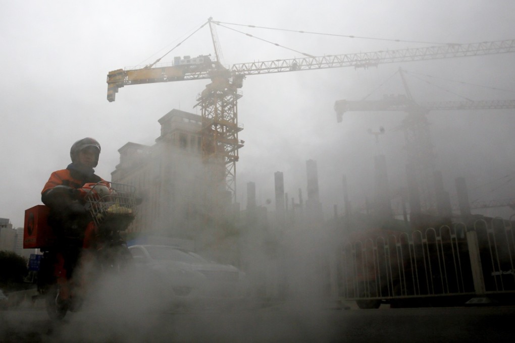 A delivery man rides through thick air pollution in Beijing. Northern China typically burns coal to heat homes in the winter, a practice believed to have fouled the air. Photo: AP