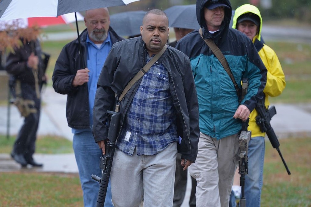 Open-carry gun activists participate in a march on November 16, 2015 in Ferguson, Missouri, exercising their right to bear arms. Photo: AFP