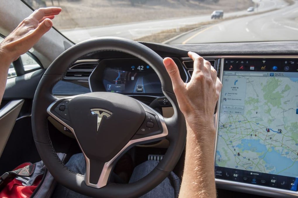 A Tesla Model S car equipped with the autopilot feature is taken for a test drive in Palo Alto, California. Photo: Bloomberg