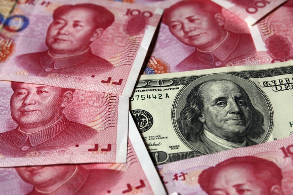 A U.S. $100 banknote is placed next to 100 yuan banknotes in this October 16, 2010 file illustration picture taken in Beijing. China's yuan may enter the International Monetary Fund's benchmark currency basket at a lower weighting than previously estimated as the IMF considers rejigging the basket to better reflect financial flows, people briefed on the Fund's discussions told Reuters. IMF policymakers are expected to add the Chinese currency to the Special Drawing Rights basket in late November 2015, after a campaign by Beijing for the yuan, or renminbi, to have equal billing with the dollar, euro, pound sterling and yen. REUTERS/Petar Kujundzic/Files