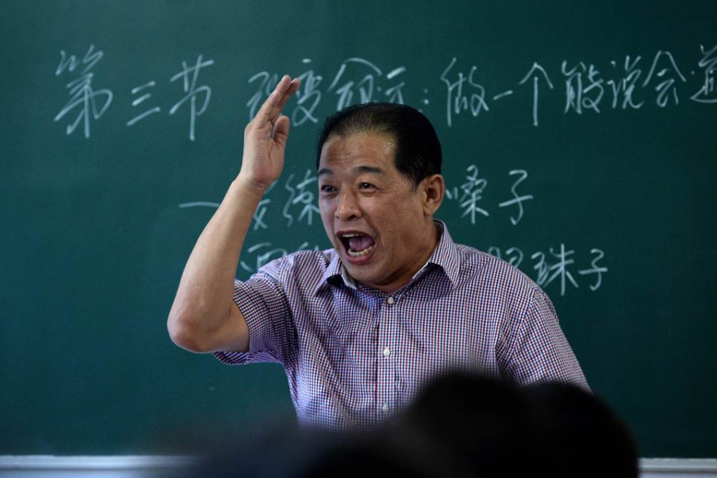 Xiu Weiliang, founder of ’Art of Communication School, teaching a class on public speaking in the northeastern city of Harbin, in China's Heilongjiang province. Photo: AFP