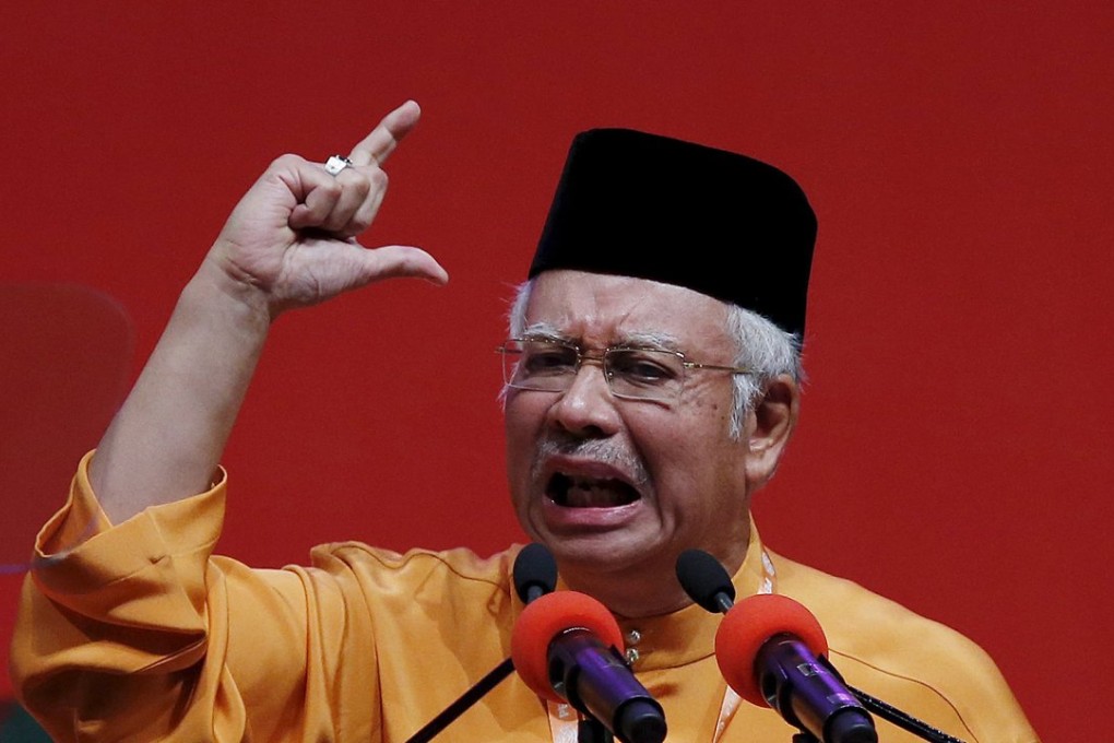 Malaysia's Prime Minister Najib Razak gives the keynote address during the United Malays National Organisation (UMNO) annual assembly at the Putra World Trade Centre in Kuala Lumpur. Photo: Reuters