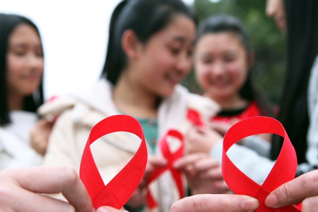 Chinese volunteers take part in an event to mark World Aids Day in Chongqing. Photo: AFP