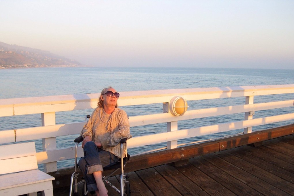 Holly Woodlawn sits on Fisherman’s Pier in Malibu, California in 2012. Her lufe story was immortalised in Lou Reed's “Walk on the Wild Side”. Photo: AP/David Chick