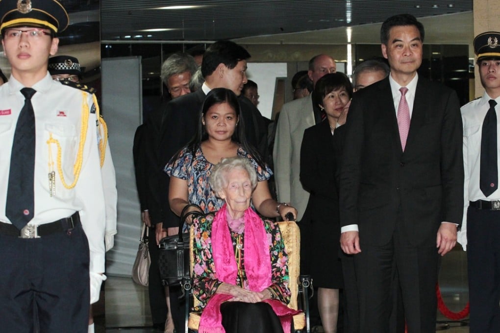 Tu (seated) with Leung Chun-ying and other guests at her 100th birthday banquet. Photo: Felix Wong