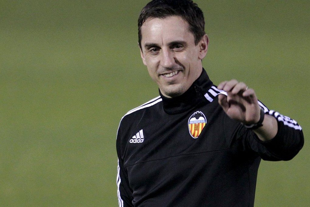 Gary Neville greets the public during his first training session in Valencia. Photo: Reuters