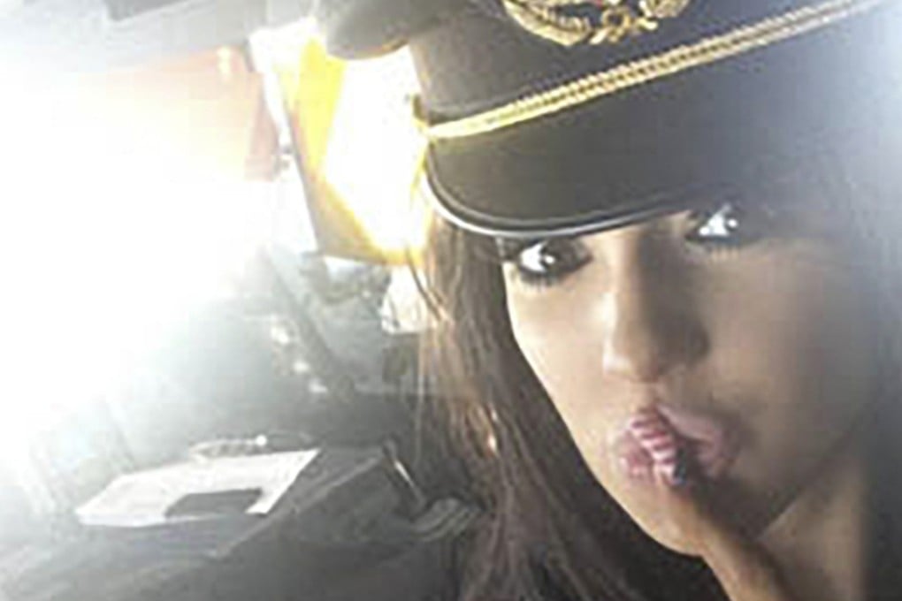 Chloe Mafia wears a pilot’s hat in the cockpit of a Kuwait Airways flight, in an image shared on social media. Photo: Instagram