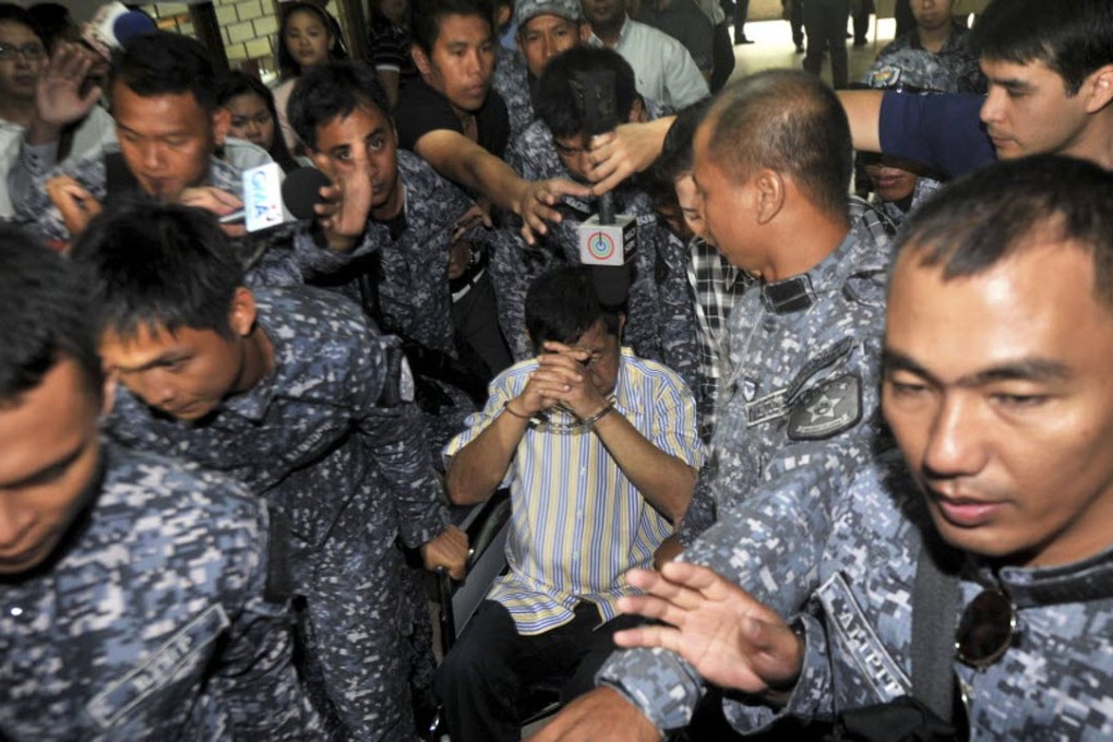 Andal Ampatuan Sr. (centre), a powerful Filipino clan leader who is a suspect in the 2009 massacre of 57 people. Photo: AP