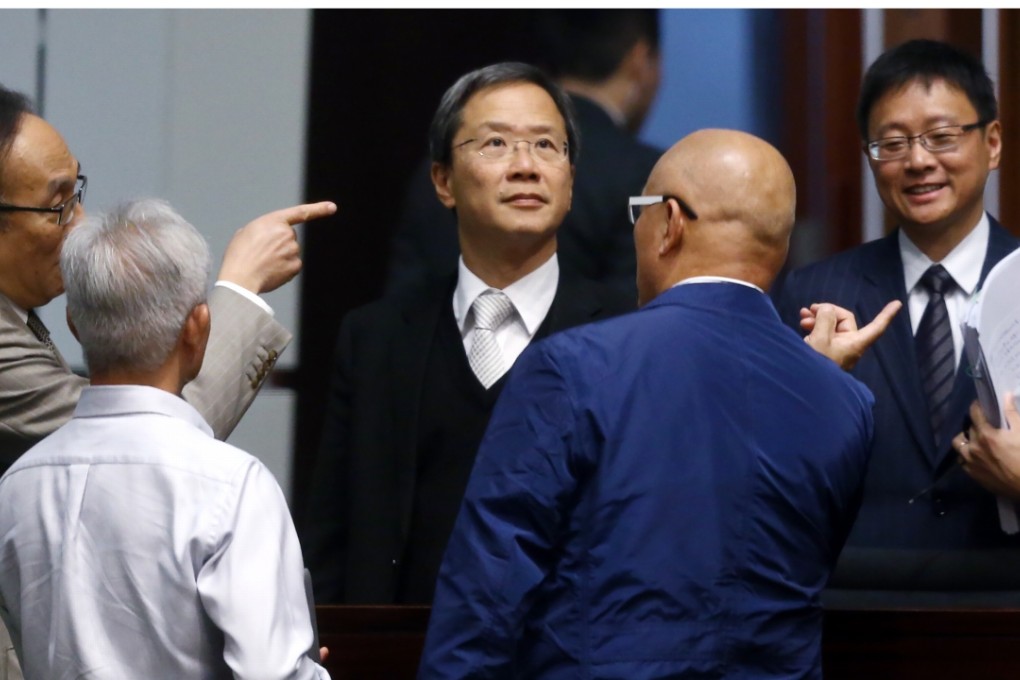 Legislators (L-R) Alan Leong Kah-ki, Kowk ka-ki and Chan Ka-lok with other Pan-democratic legislators with fingers in form for a vote as the day’s Legco meeting unexpectedly adjourned with insufficient quorum. Photo: Sam Tsang