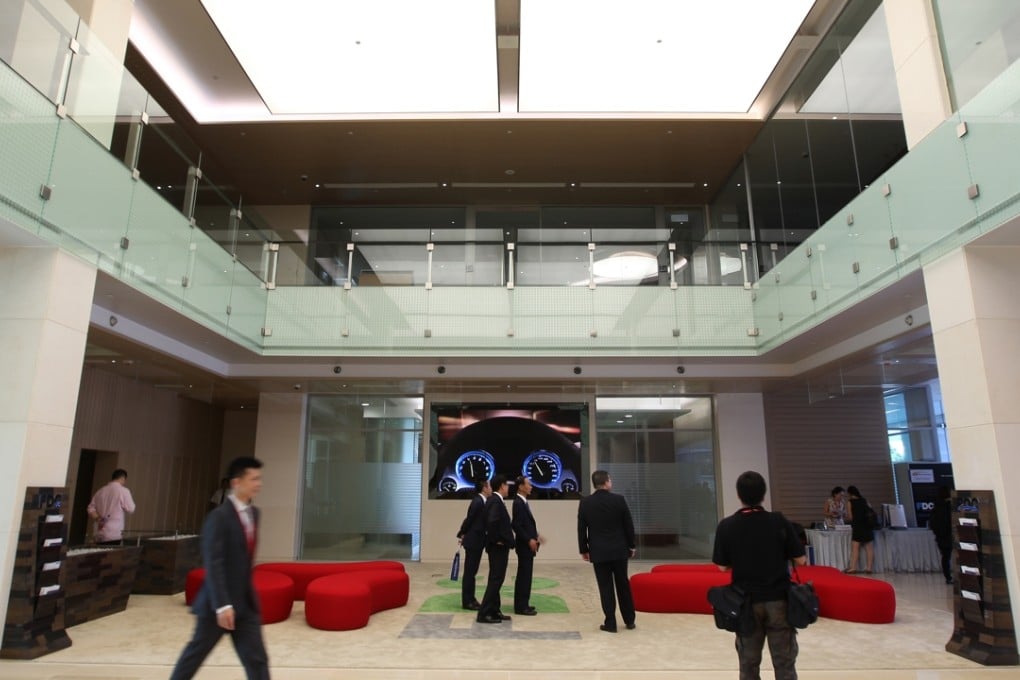 Guests mill around the entrance of NTT Communications Hong Kong Financial Data Centre before the opening ceremony in May 2013, in this file photo. A new phase-two facility in Tseung Kwan O should take the company’s infrastructure capacity in the city to over 10,000 racks. Photo: SCMP Pictures