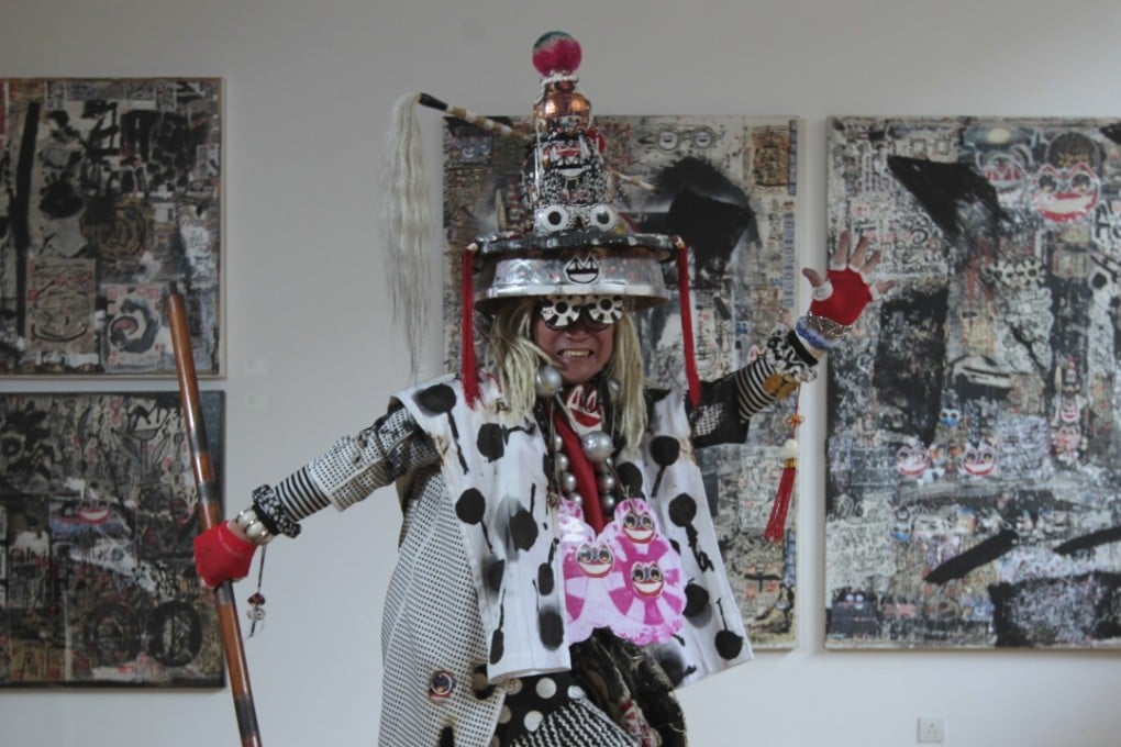 Frog King, aka Kwok Mang-ho, in front of some recent works at 10 Chancery Lane Gallery in Central. Photo: Bruce Yan