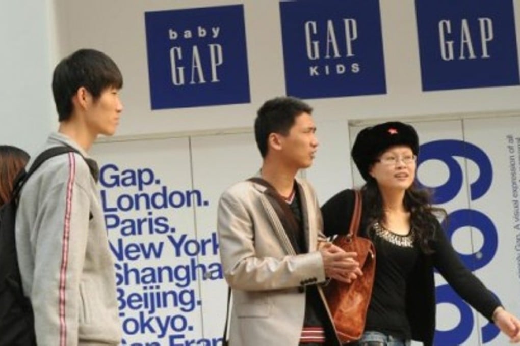Shoppers on the streets of Beijing. The risk that Chinese consumption might sink is not only a risk for domestic policymakers but also for foreign firms. Photo: AFP
