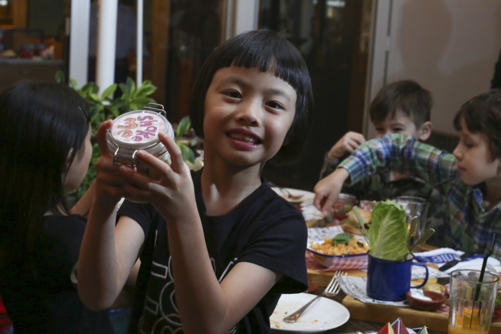 Hava Lee has fun mixing a salad at Jamie's Italian in Tsim Sha Tsui. Photo: Nora Tam
