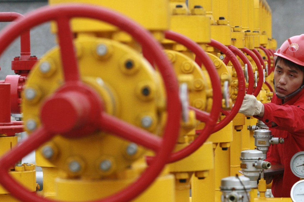 A worker checks the pipelines at a PetroChina oil field on the outskirts of Guangan, Sichuan province. Photo: Reuters