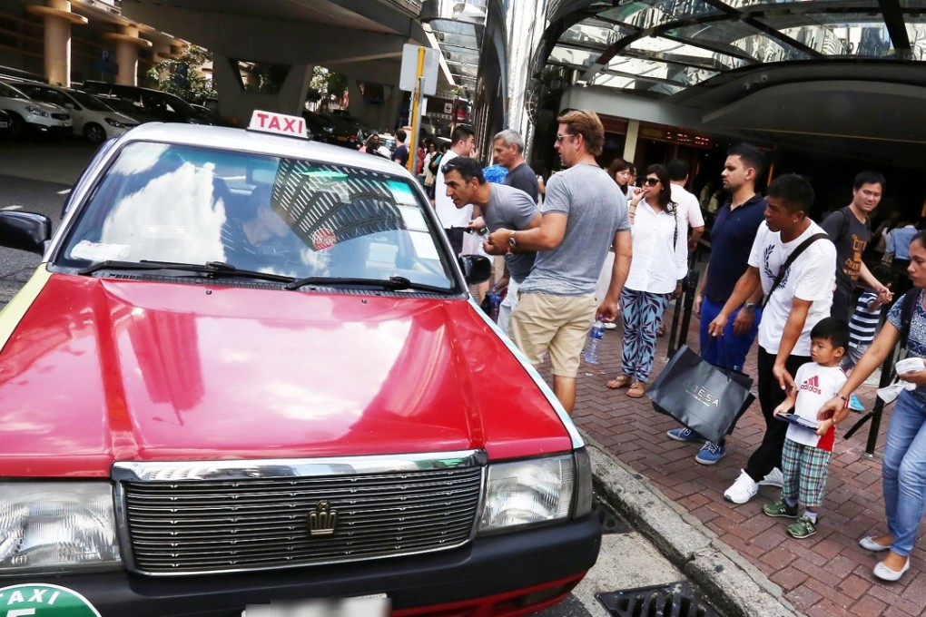 Taxis regularly pick up tourists outside the Peak Tram terminus in Central. Photo: SCMP Pictures