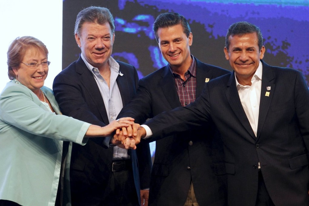 Presidents (left to right) Michelle Bachelet from Chile, Juan Manuel Santos from Colombia, Enrique Pena Nieto from Mexico and Ollanta Humala from Peru pose for a photo at July’s Pacific Alliance summit in Paracas, Peru. Photo: Reuters