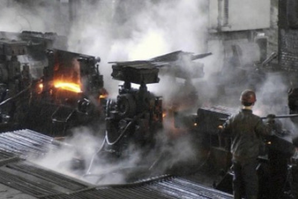 A worker operates machinery at a steel refinery in Liaoning province. The northeast’s economy has suffered because of its reliance on ailing state-owned heavy industries. Photo: Xinhua