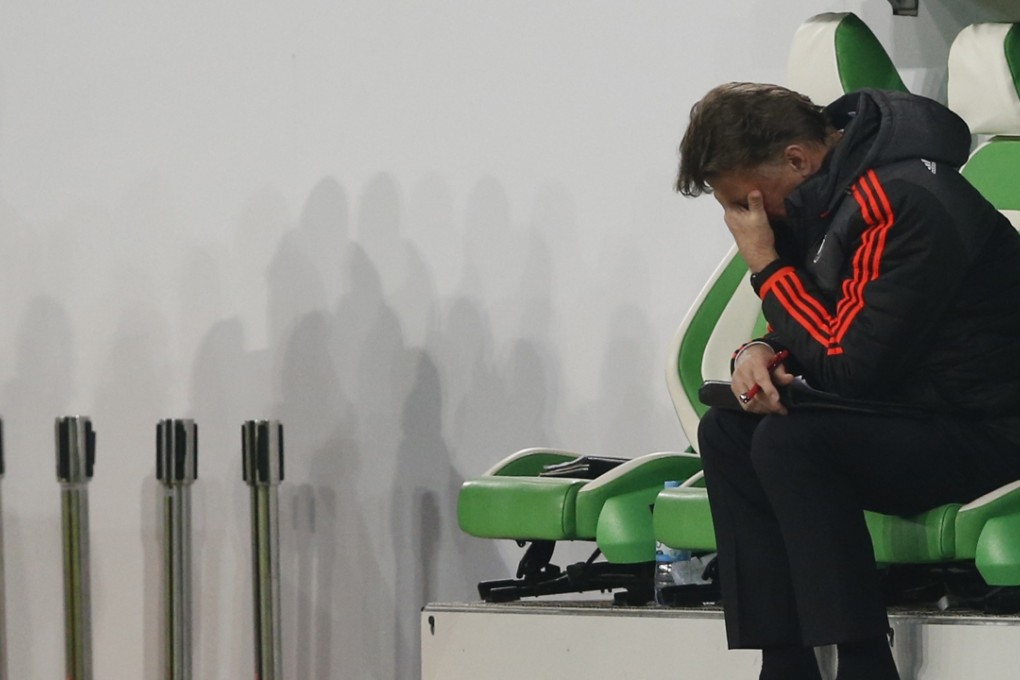 Louis van Gaal looks dejected as United crash out of the Champions League. Photo: Reuters
