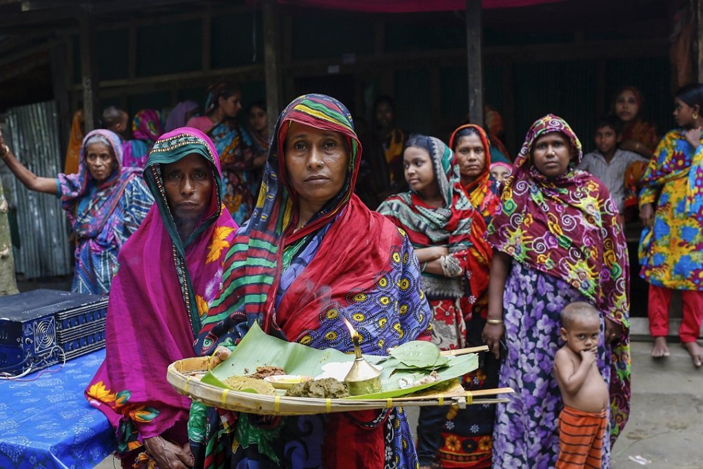 A group of women made homeless by flooding in Bangladesh earlier this year. It is one of the countries most at risk from the more volatile weather conditions created by climate change. Photo: AP
