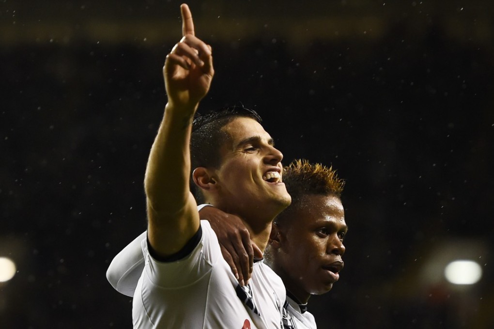 Erik Lamela celebrates his hat-trick. Photo: Reuters