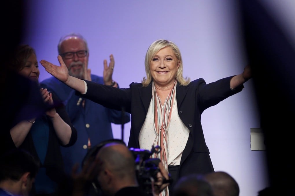 Marine Le Pen, French National Front political party leader and candidate for the Nord-Pas-de-Calais-Picardie region, arrives at a political rally in Paris. Photo: Reuters