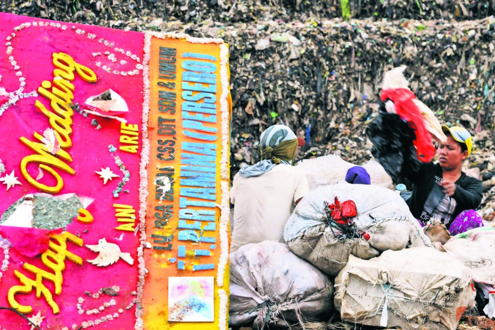 Scavengers sort through a pile of waste in Bantar Gebang on the outskirts of Jakarta. Photo: AFP