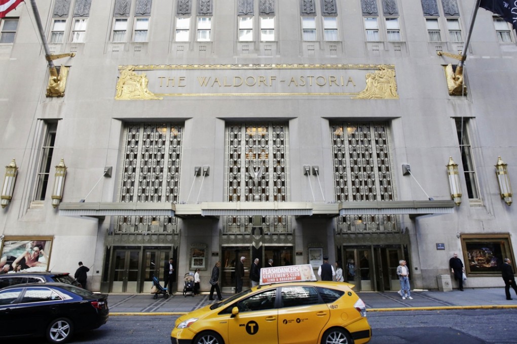 A New York city taxi passes in front of the fabled Waldorf Astoria hotel in New York, which was purchased by a Chinese insurance company as part of an outflow of investment outside the country. Photo: AP