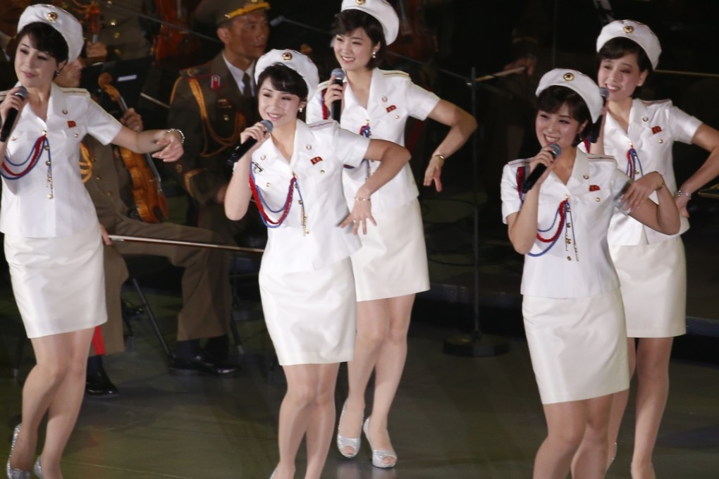 Members of North Korea's Moranbong band sing and dance during a joint performance with the State Merited Chorus in Pyongyang in October. Photo: AP