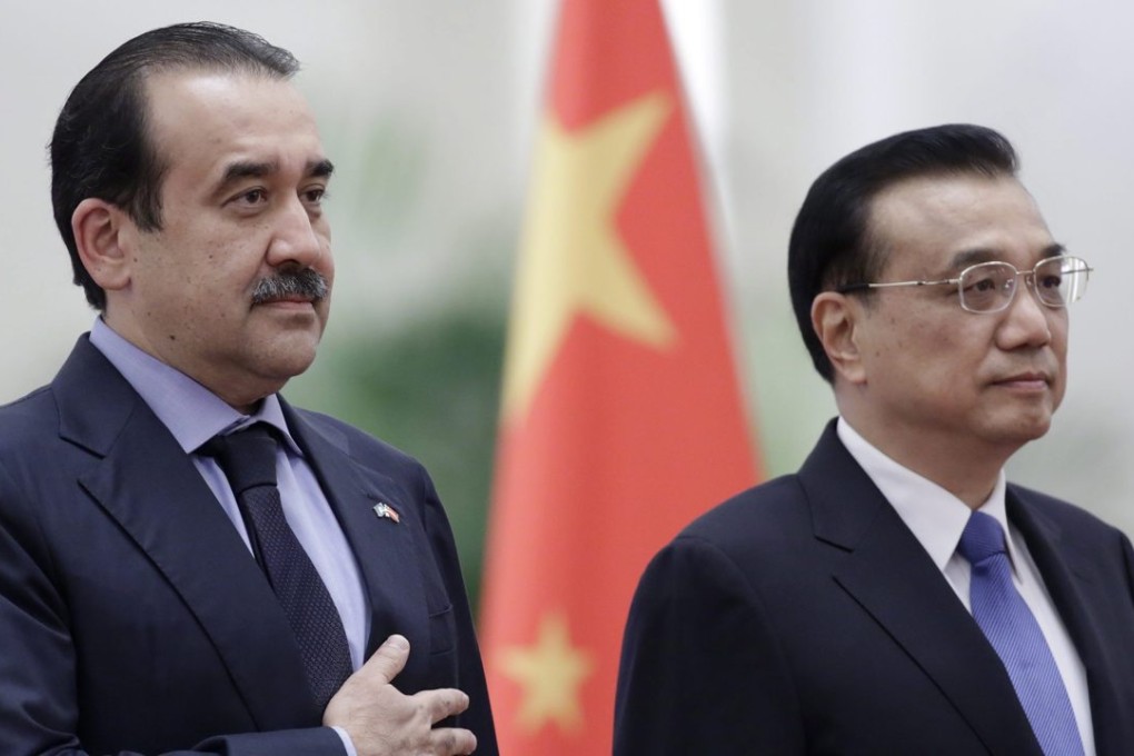 Kazakhstan’s Prime Minister Karim Massimov with Chinese Premier Li Keqiang at a welcoming ceremony in Beijing before the talks on Monday. Photo: EPA