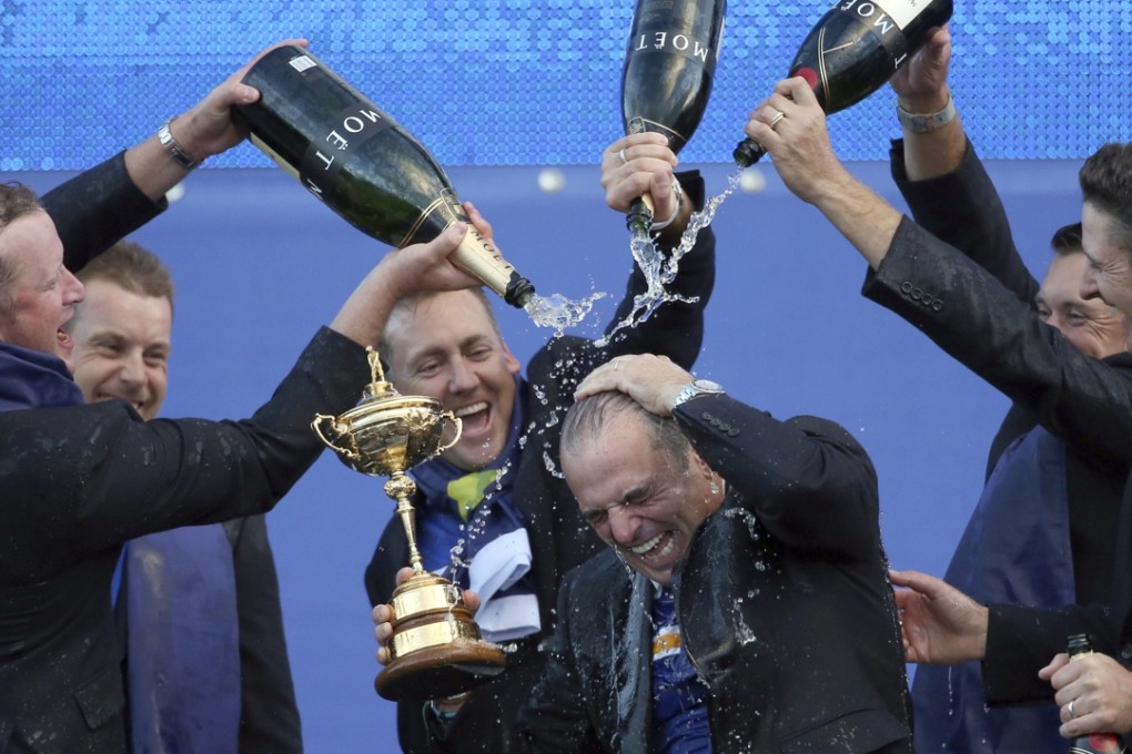 Europe's players Jamie Donaldson, Henrik Stenson, Ian Poulter, Lee Westwood and Justin Rose pour champagne over captain Paul McGinley after winning the 2014 Ryder Cup at Gleneagles, Photo: AP